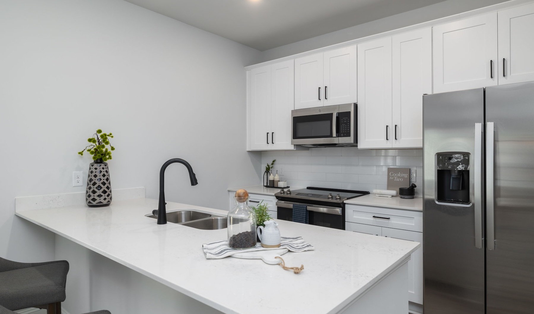 a kitchen with white cabinets