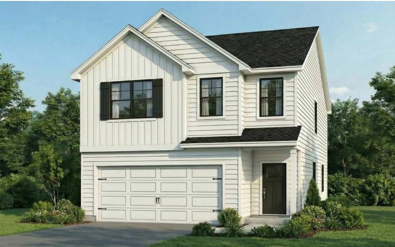 a white house with a garage