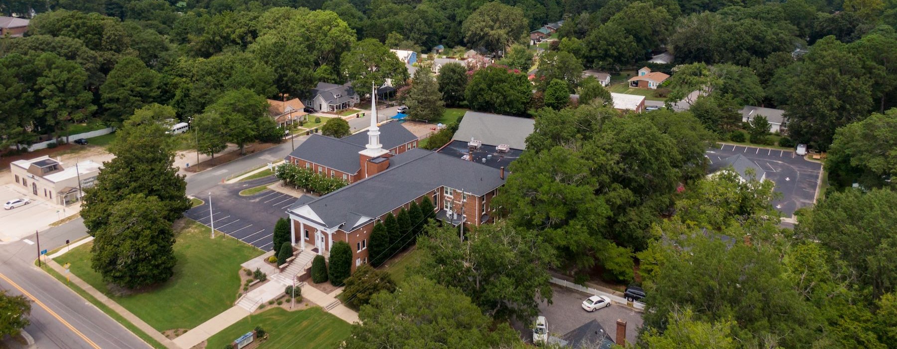 an aerial view of a building with trees