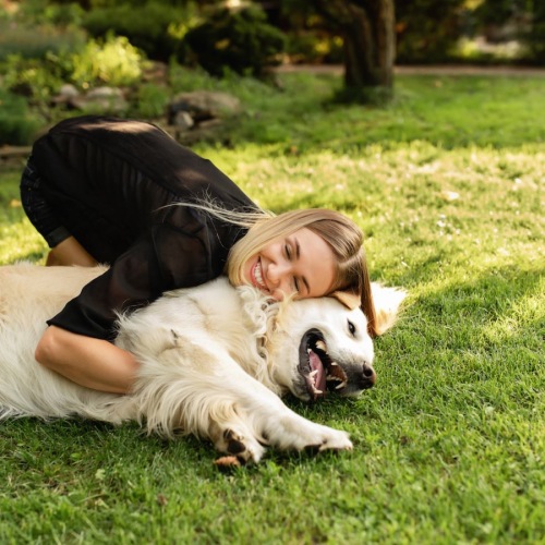 a person lying on a dog