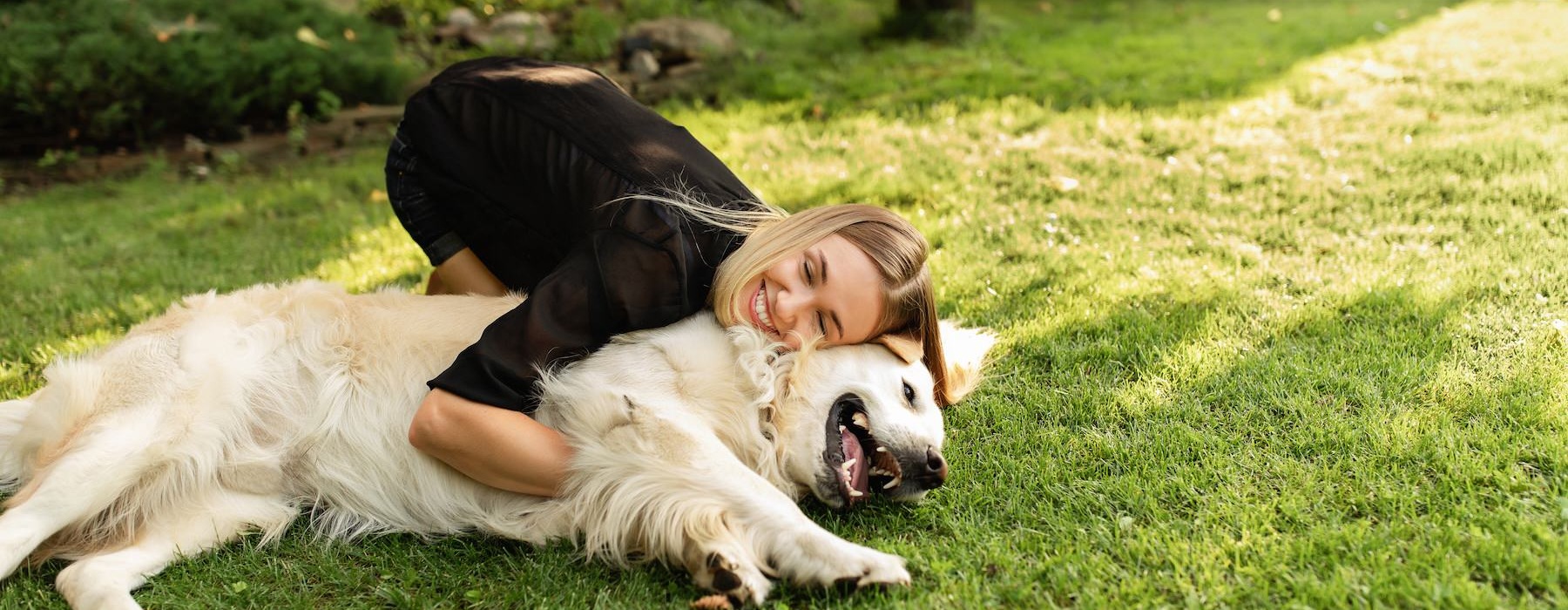 a person lying on a dog
