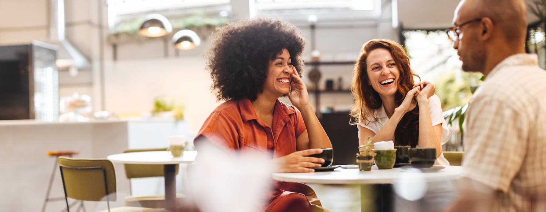 people sitting at a table in a restaurant