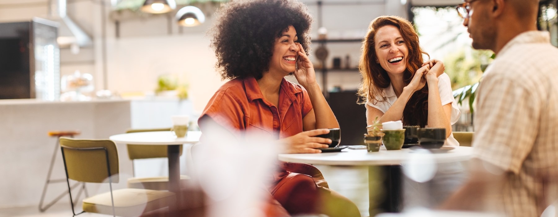 people sitting at a table in a restaurant
