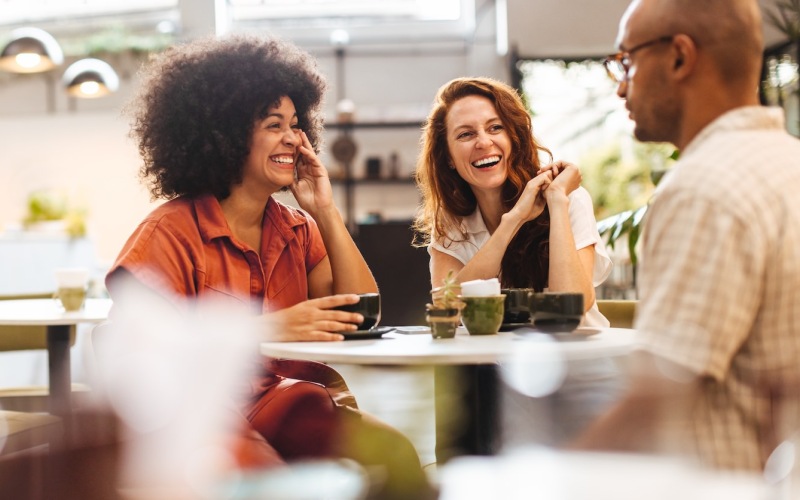 people sitting at a table in a restaurant