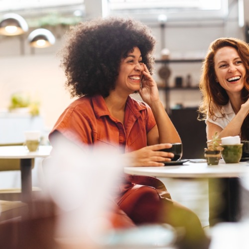 people sitting at a table in a restaurant