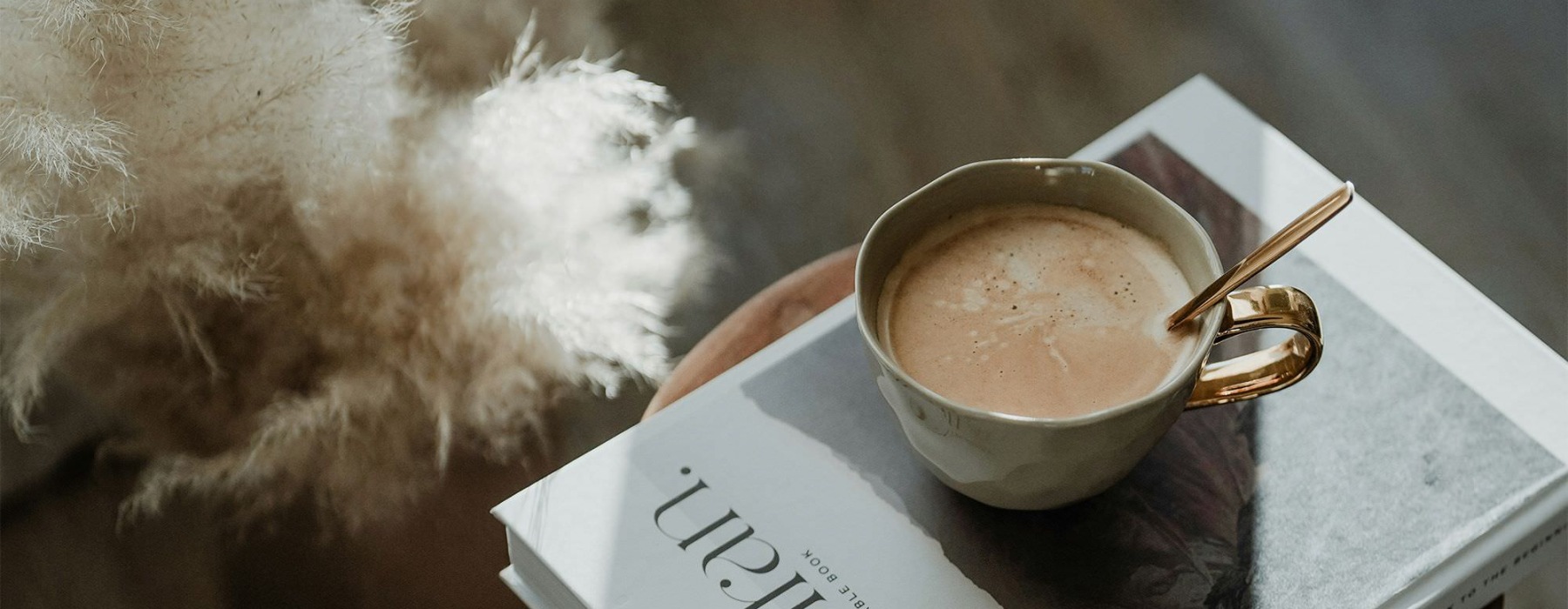 a cup of coffee on a book