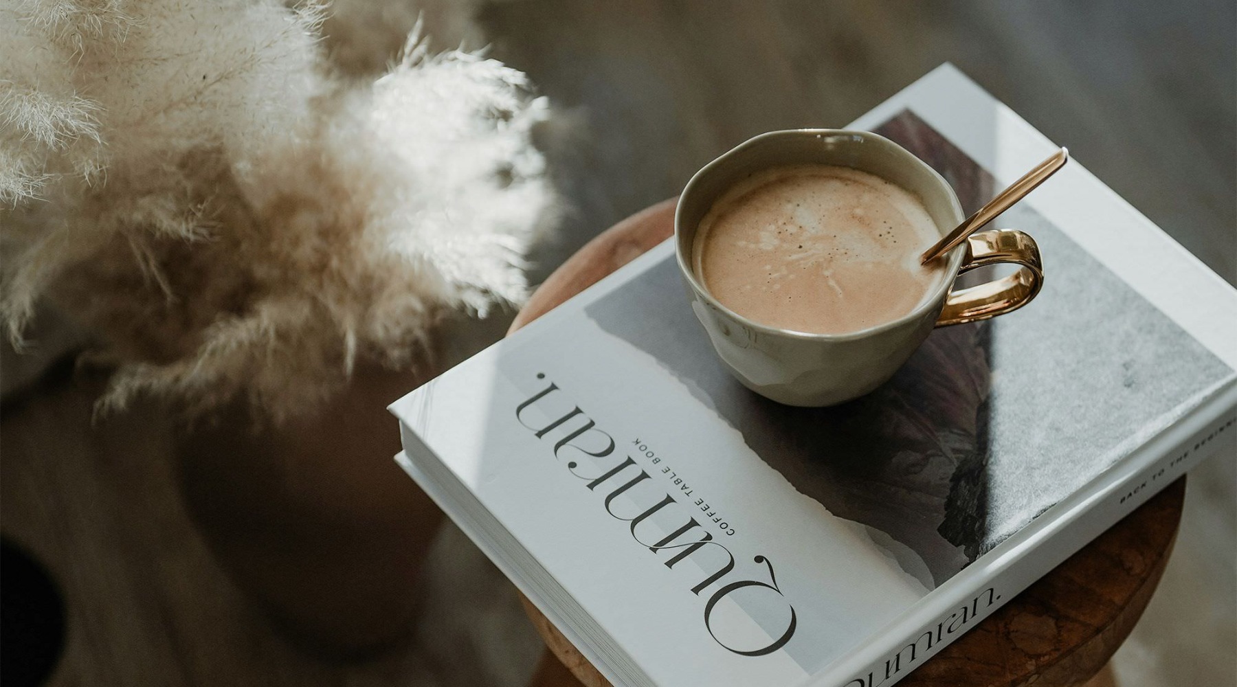 a cup of coffee on a book