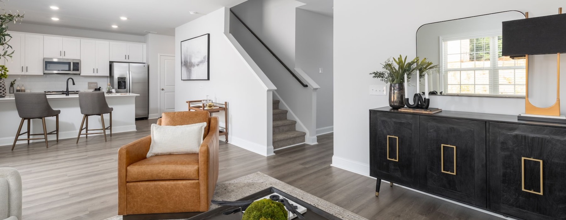 a living room with tables and chairs